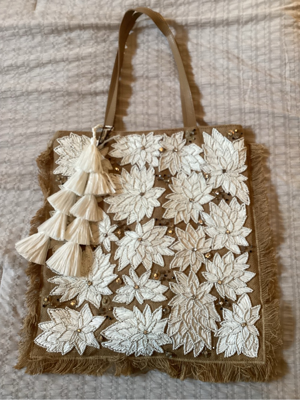 ANTHROPOLOGIE IbBan Beige Floral Appliqué Tote with Tassel Accent. NWT
